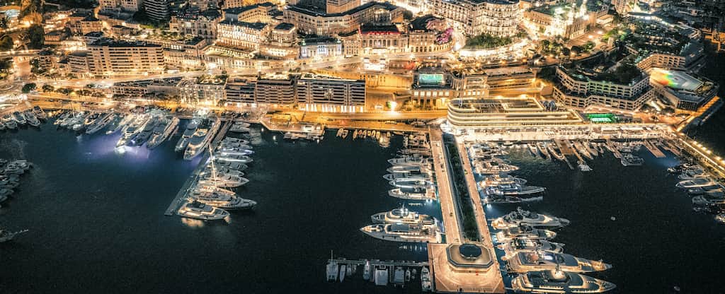 Panoramic night view over Monaco where the Investor Lounge takes place